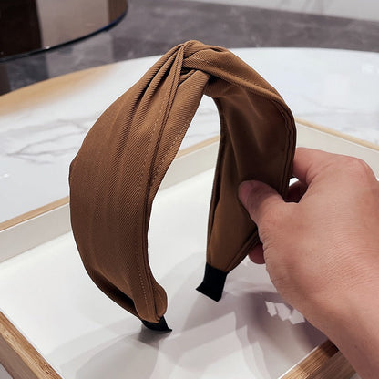 Fashionable fabric cross bow headband