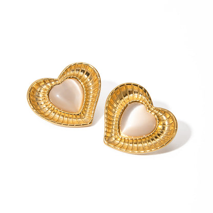 White cat eye stone earrings with niche temperament titanium steel earrings